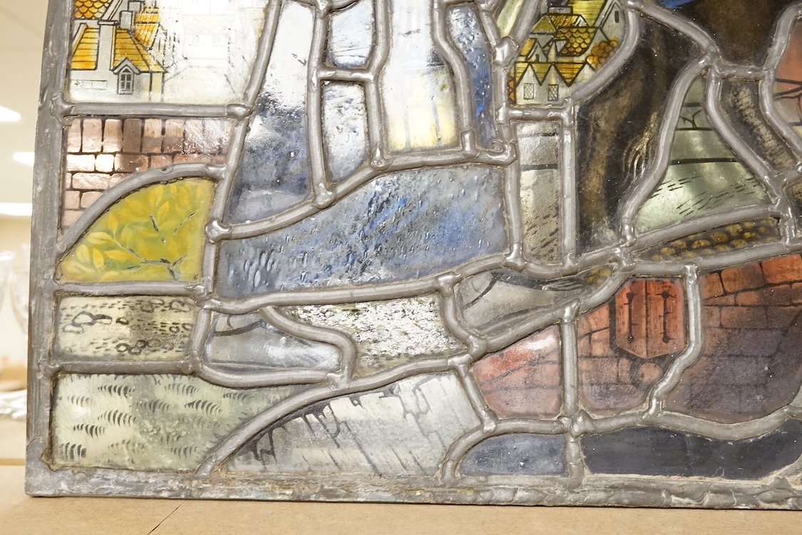 A 20th century semi circular stained glass panel, approximately 80cm wide